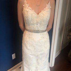 Casablanca size 10 wedding dress ivory. This dress was tailored to fit a size 4